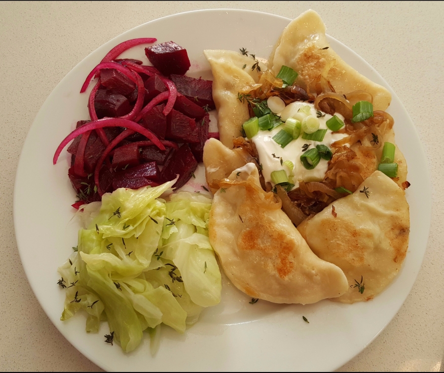 Potato, Cheese, and Mushroom  Pierogis served with Garlic Sautéed Cabbage and Beet Salad